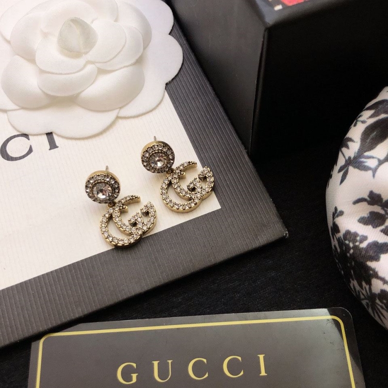 G*u*i earrings